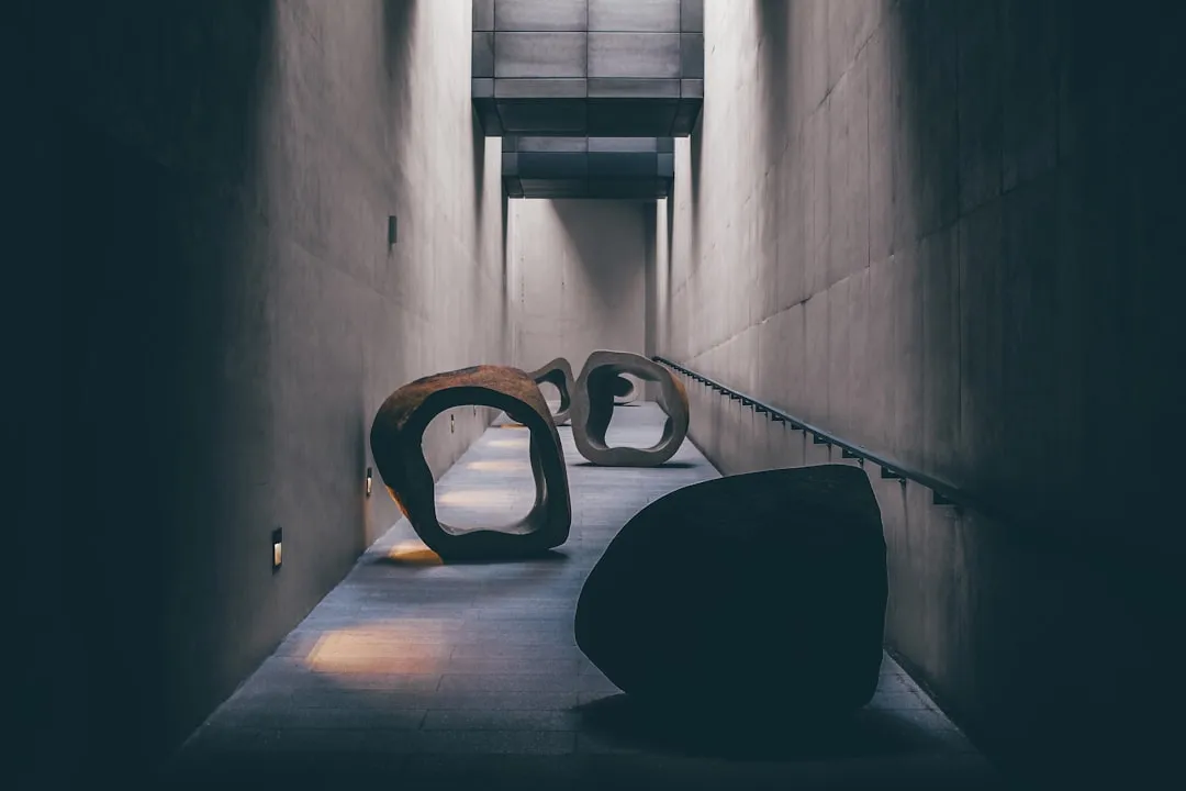 a couple of large sculptures sitting on top of a cement floor